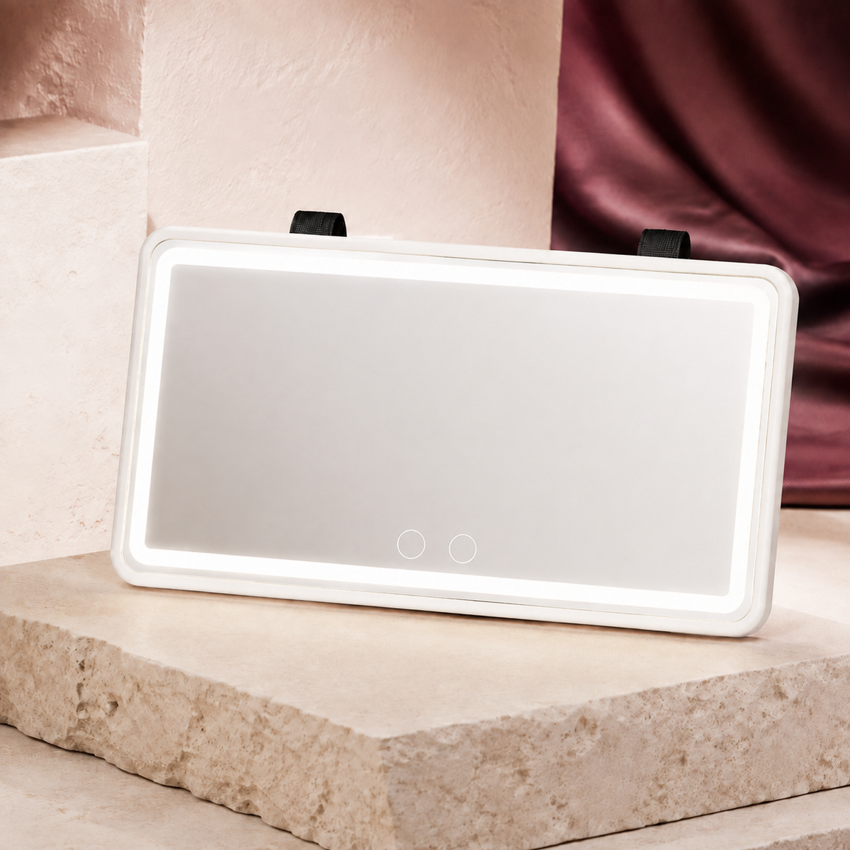GlowDrive three-tone LED visor mirror with a White Frame on a warm ivory studio plinth