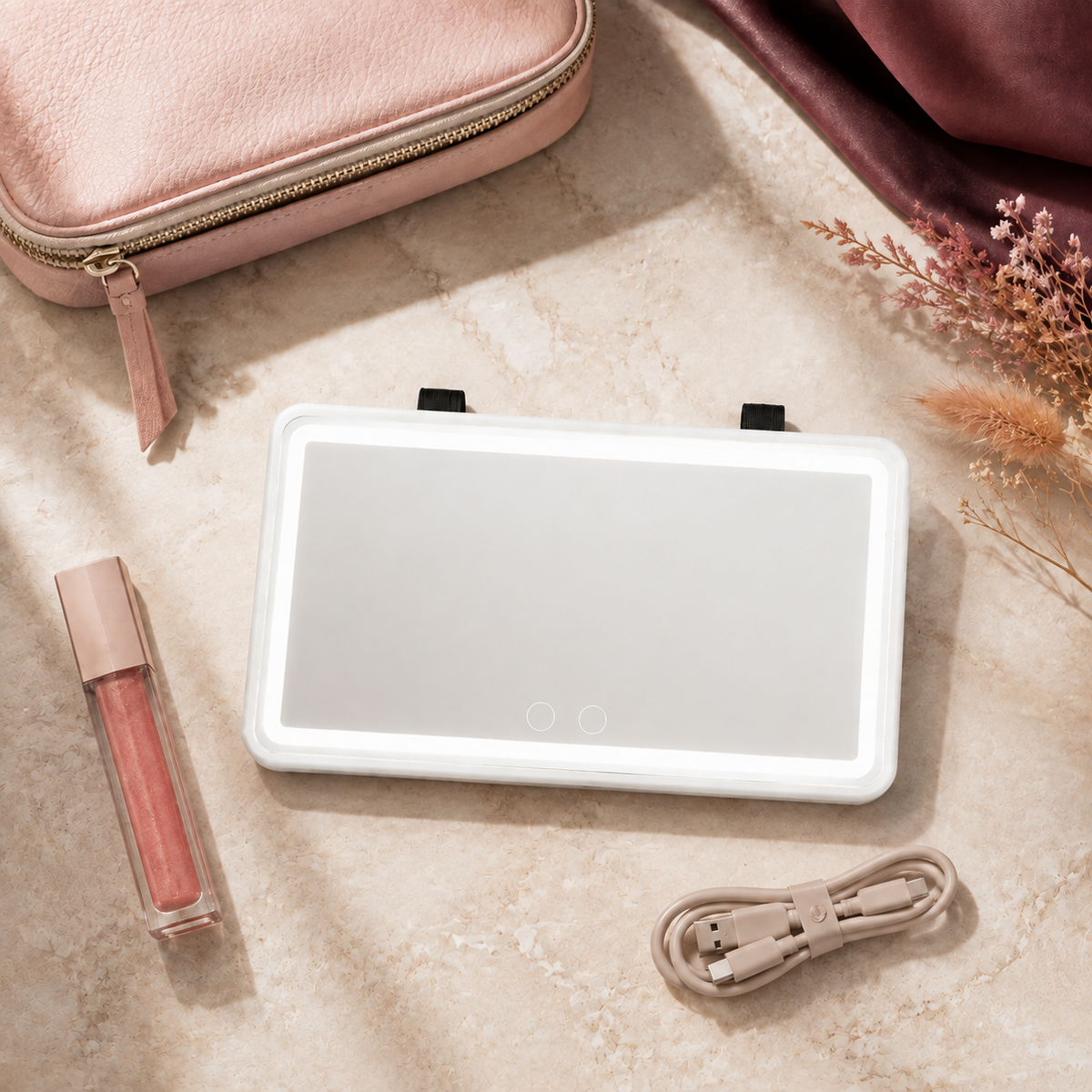 White Frame GlowDrive visor mirror arranged for a polished travel beauty routine