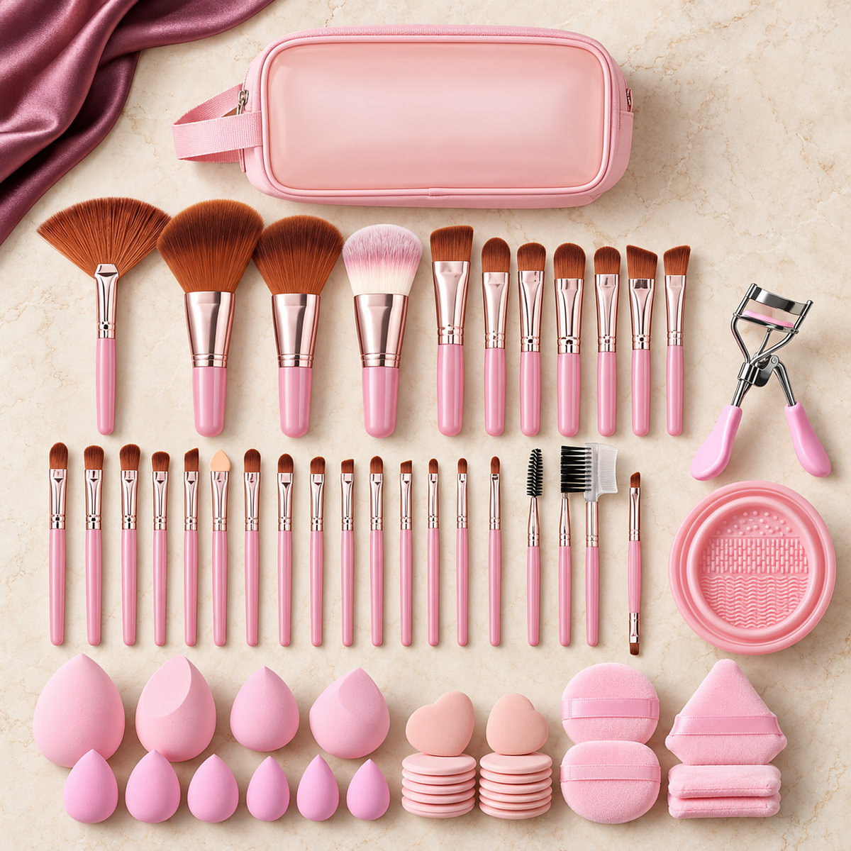 Styled overview of the Complete Glam Tool Suite brush, sponge, puff, curler, cleaning and travel essentials