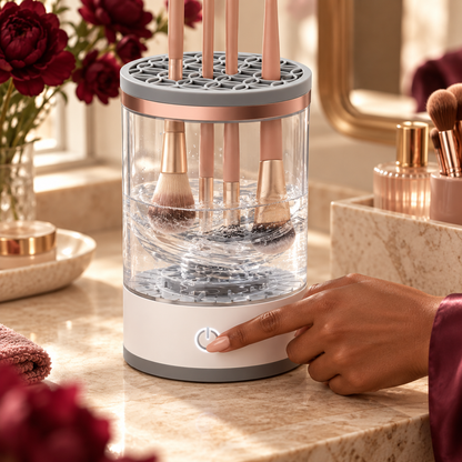 PureBrush station washing makeup brushes on an elegant warm-toned vanity