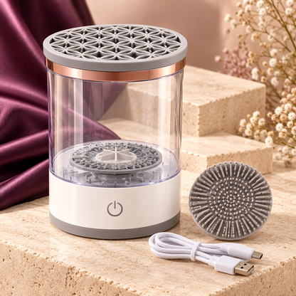 PureBrush electric wash and dry station with scrub pad and USB cable on an ivory studio plinth